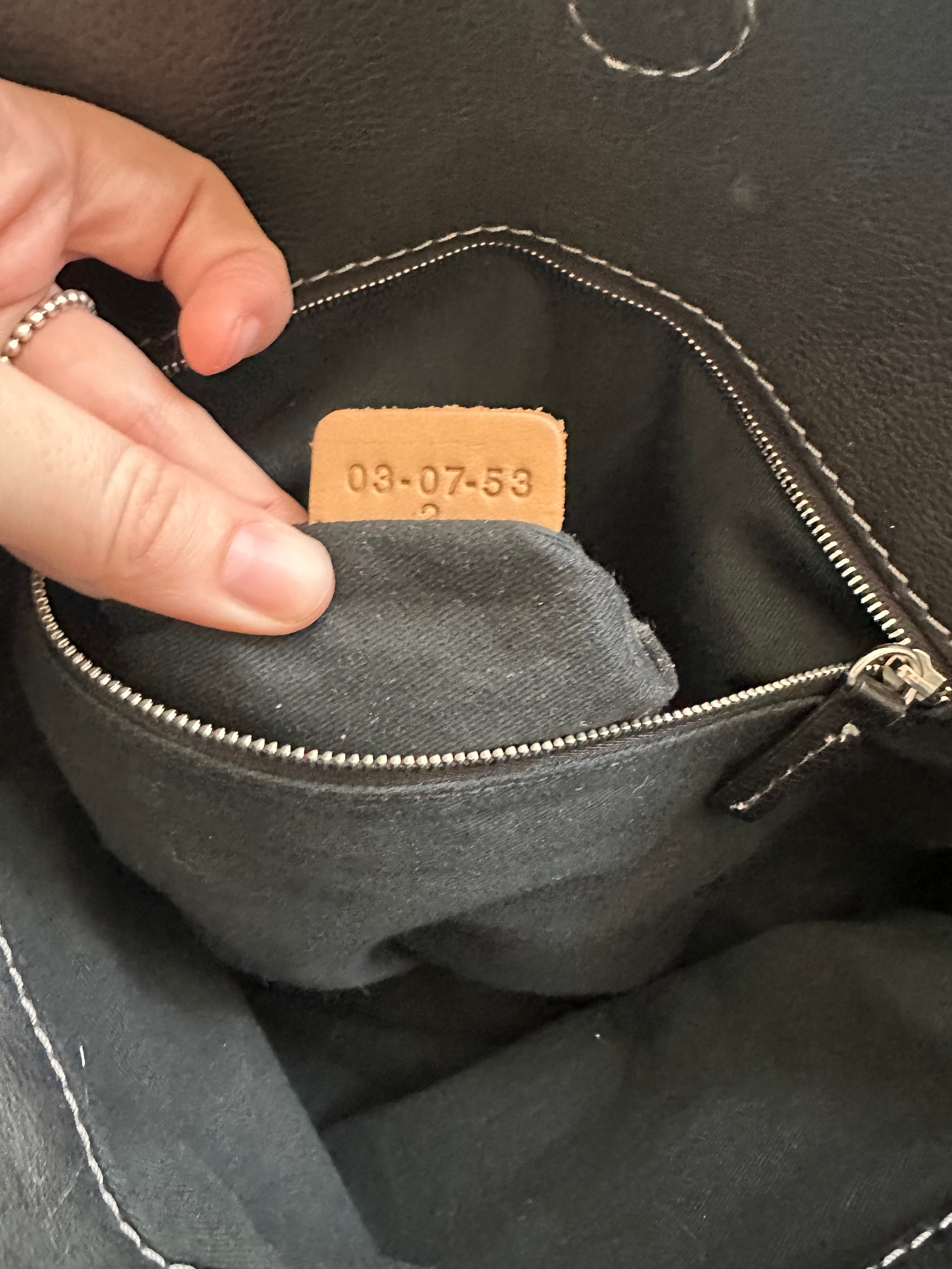 Interior zip pocket of vintage Chloé Paddington Capsule bag with tan leather Chloé branded tab