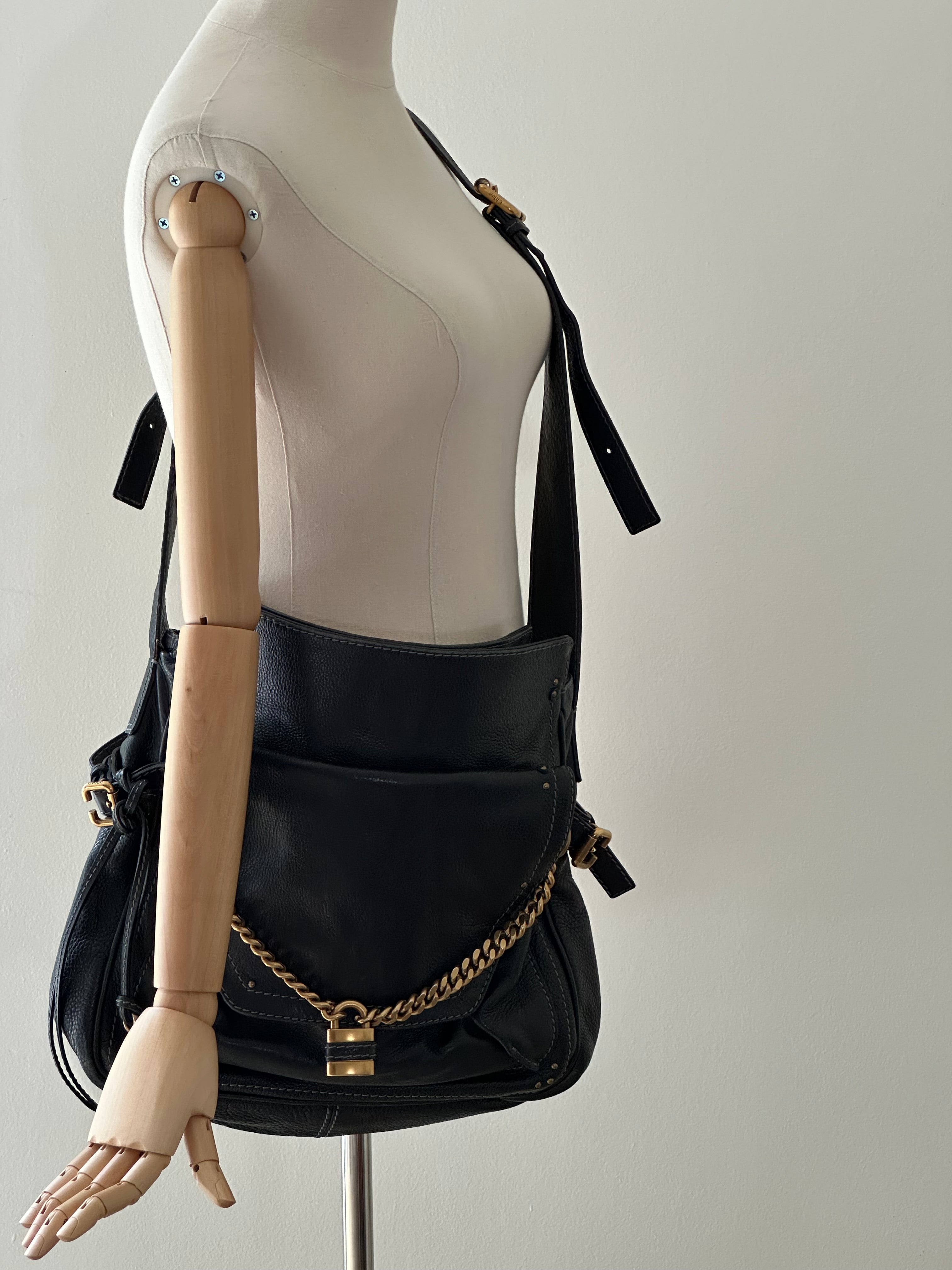 Vintage Chloé Paddington Capsule black leather bag worn on mannequin, crossbody styling with detachable leather strap
