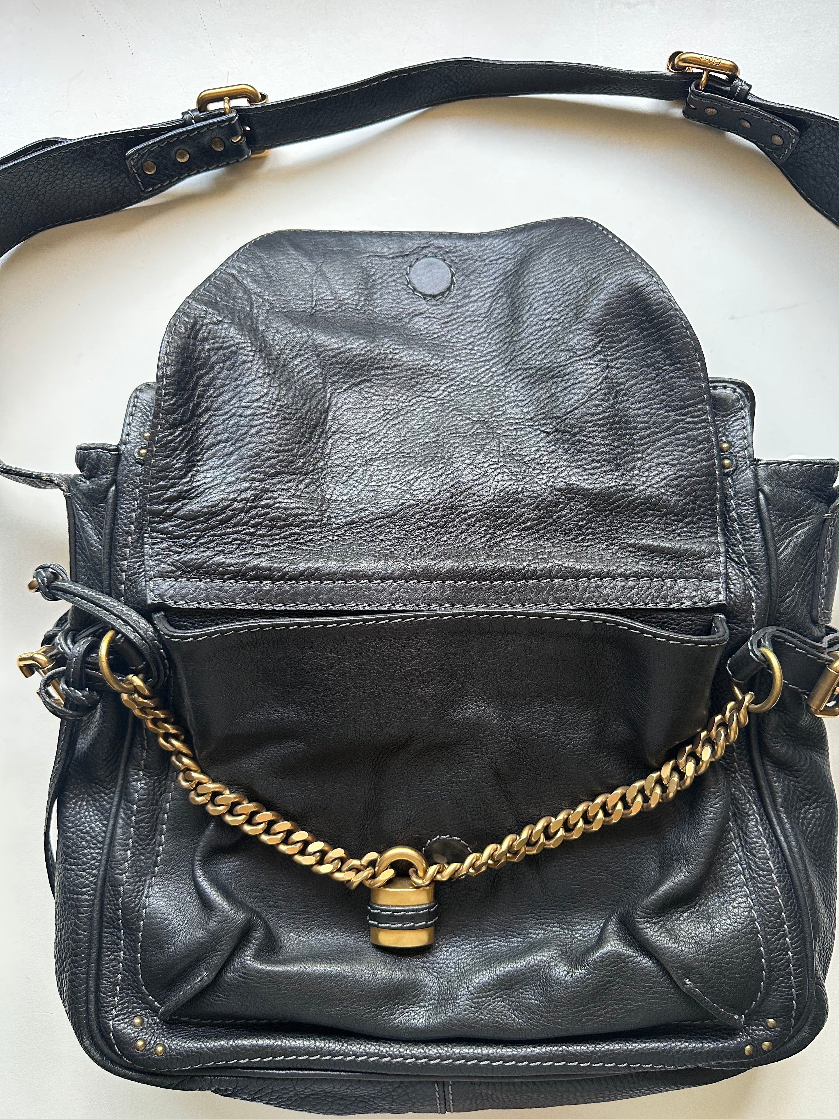 Interior view of vintage Chloé Paddington Capsule bag showing black fabric lining and zip pocket