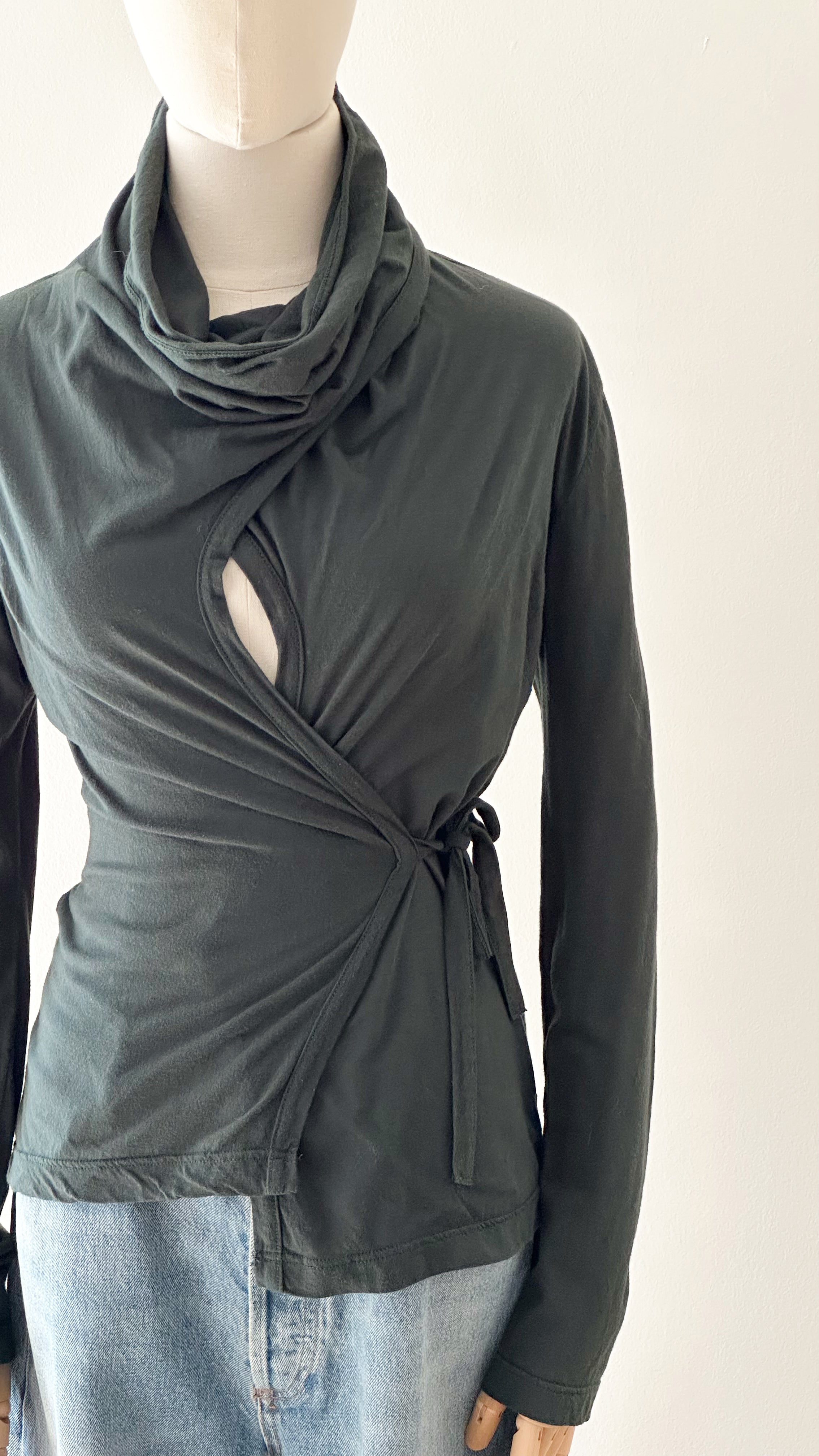 hunter green archival dries van noten jersey top on a dress form.